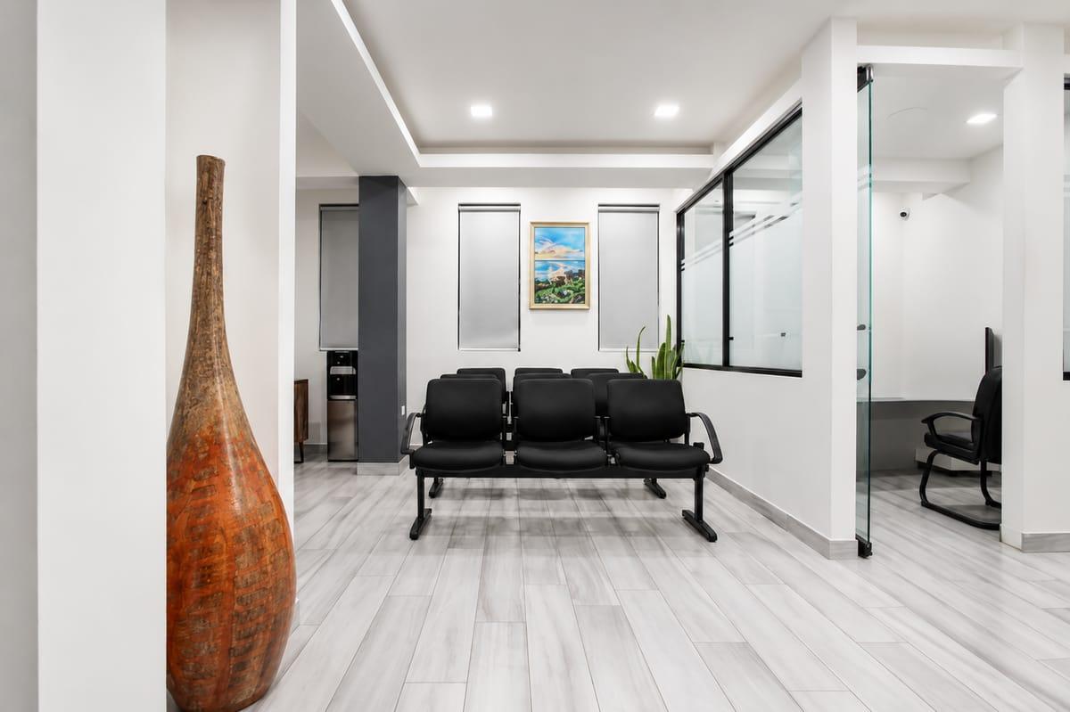 Quiet waiting area inside Morgan's Funeral Home with seating, natural light, and a large ceramic vase